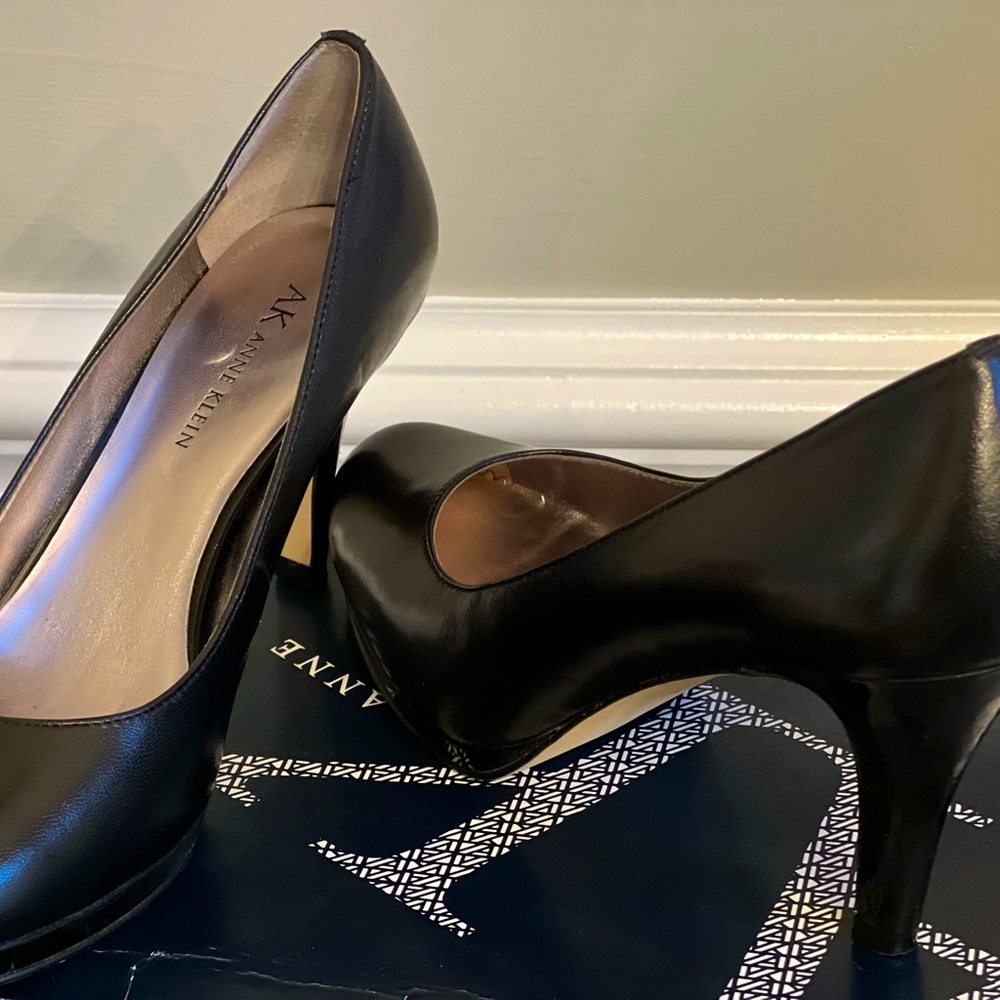 Black 7 1/2 Ann Klein pumps. Has a platform from toe to ball of foot.